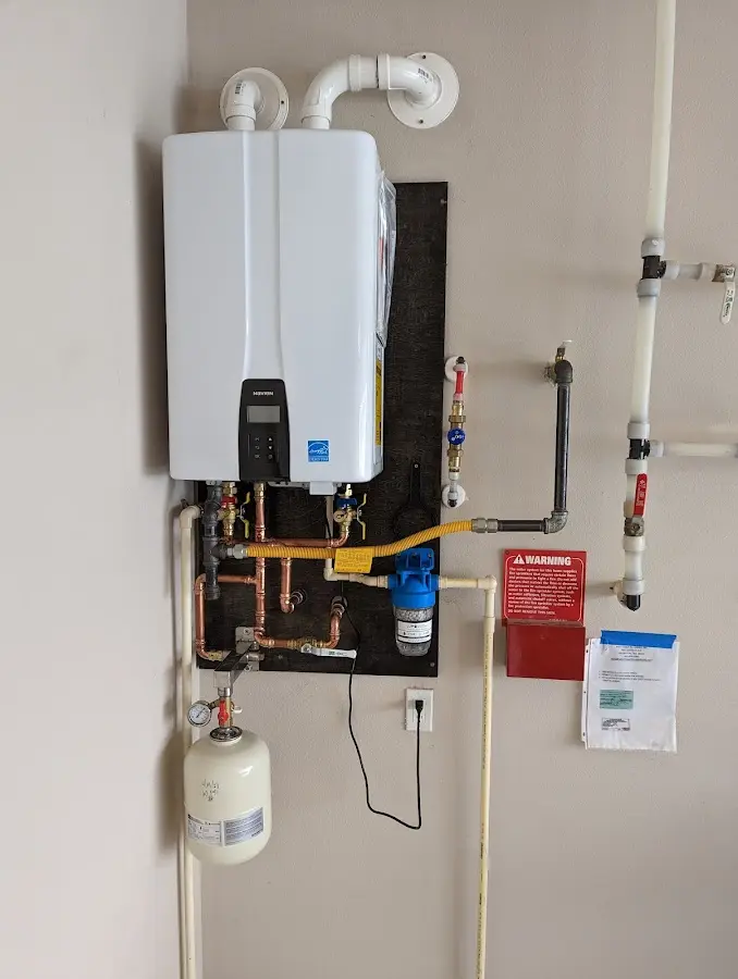 Professional plumber installing copper piping in a Wyomissing home